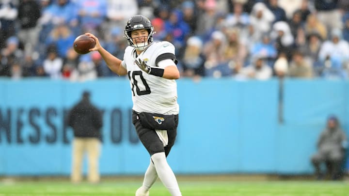 Dec 8, 2024; Nashville, Tennessee, USA;   Jacksonville Jaguars quarterback Mac Jones (10) gets flushed from the pocket against the Tennessee Titans during the second half at Nissan Stadium. Mandatory Credit: Steve Roberts-Imagn Images