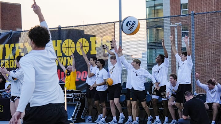 The Iowa men’s basketball team reacts after a halfcourt shot is made during the Hawkeye Hoops from Downtown event Oct. 17, 2025 on the University of Iowa campus in Iowa City, Iowa.