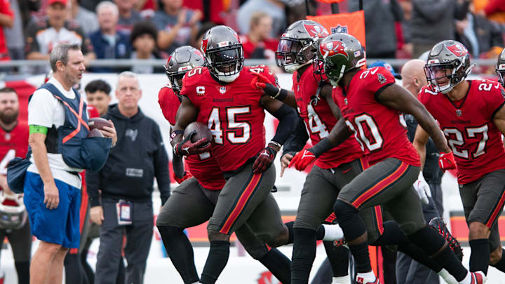 Dec 24, 2023; Tampa, Florida, USA; Tampa Bay Buccaneers linebacker Devin White (45), linebacker Lavonte David (54) and Tampa Bay Buccaneers defensive back Dee Delaney (30) celebrate a turnover against the Jacksonville Jaguars in the first quarter at Raymond James Stadium. Mandatory Credit: Jeremy Reper-Imagn Images Dec 24, 2023; Tampa, Florida, USA; Tampa Bay Buccaneers linebacker Devin White (45), linebacker Lavonte David (54) and Tampa Bay Buccaneers defensive back Dee Delaney (30) celebrate a turnover against the Jacksonville Jaguars in the first quarter at Raymond James Stadium. Mandatory Credit: Jeremy Reper-Imagn Images