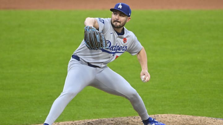 May 26, 2025; Cleveland, Ohio, USA; Los Angeles Dodgers relief pitcher Alex Vesia (51) delivers a pitch in the seventh inning against the Cleveland Guardians at Progressive Field. Mandatory Credit: David Richard-Imagn Images