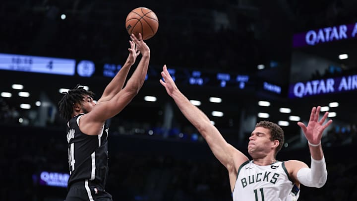 Dec 27, 2023; Brooklyn, New York, USA; Brooklyn Nets guard Cam Thomas (24) shoots the ball as Milwaukee Bucks center Brook Lopez (11) defends during the first quarter at Barclays Center. Mandatory Credit: Vincent Carchietta-Imagn Images Dec 27, 2023; Brooklyn, New York, USA; Brooklyn Nets guard Cam Thomas (24) shoots the ball as Milwaukee Bucks center Brook Lopez (11) defends during the first quarter at Barclays Center. Mandatory Credit: Vincent Carchietta-Imagn Images