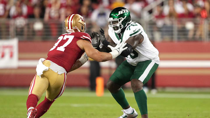 Sep 9, 2024; Santa Clara, California, USA; New York Jets offensive tackle Morgan Moses (right) blocks San Francisco 49ers defensive end Nick Bosa (left) during the fourth quarter at Levi's Stadium. Sep 9, 2024; Santa Clara, California, USA; New York Jets offensive tackle Morgan Moses (right) blocks San Francisco 49ers defensive end Nick Bosa (left) during the fourth quarter at Levi's Stadium.