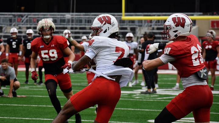 Wide receiver Shamar Rigby spins free from defenders. Wide receiver Shamar Rigby spins free from defenders.