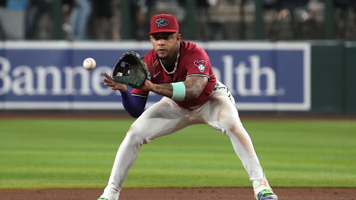 Sep 3, 2025; Phoenix, Arizona, USA; Arizona Diamondbacks second base Ketel Marte (4) gets the force out against the Texas Rangers in the fifth inning at Chase Field. Mandatory Credit: Rick Scuteri-Imagn Images