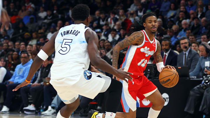 Jan 20, 2025; Memphis, Tennessee, USA; Memphis Grizzlies guard Ja Morant (12) dribbles as Minnesota Timberwolves guard Anthony Edwards (5) defends during the first half at FedExForum. Mandatory Credit: Petre Thomas-Imagn Images Jan 20, 2025; Memphis, Tennessee, USA; Memphis Grizzlies guard Ja Morant (12) dribbles as Minnesota Timberwolves guard Anthony Edwards (5) defends during the first half at FedExForum. Mandatory Credit: Petre Thomas-Imagn Images
