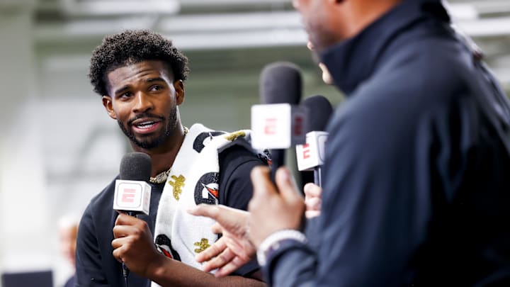 Apr 4, 2025; Boulder, CO, USA; Colorado Buffaloes quarterback Shedeur Sanders (2) talks to ESPN after the University of Colorado NFL Showcase at the CU Indoor Practice Facility. Mandatory Credit: Michael Ciaglo-Imagn Images