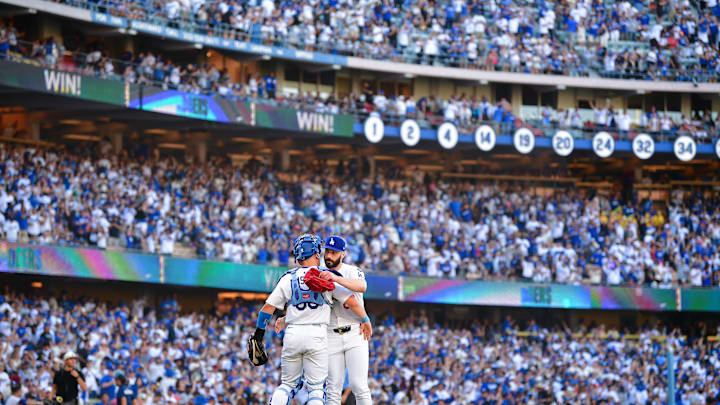 Jun 15, 2025; Los Angeles, California, USA; Los Angeles Dodgers catcher Dalton Rushing (68) and pitcher Tanner Scott (66) celebrate the victory against the San Francisco Giants at Dodger Stadium. Mandatory Credit: Gary A. Vasquez-Imagn Images