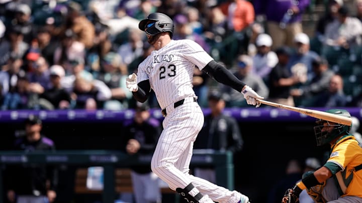 Apr 6, 2025; Denver, Colorado, USA; Colorado Rockies designated hitter Kris Bryant (23) hits a double in the third inning against the Athletics at Coors Field. Mandatory Credit: Isaiah J. Downing-Imagn Images