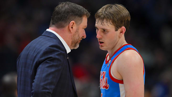 Mar 13, 2026; Nashville, TN, USA; Mississippi Rebels head coach Chris Beard talks with guard Travis Perry (11) during a break in action against the Alabama Crimson Tide during the second half at Bridgestone Arena. Mandatory Credit: Steve Roberts-Imagn Images Mar 13, 2026; Nashville, TN, USA; Mississippi Rebels head coach Chris Beard talks with guard Travis Perry (11) during a break in action against the Alabama Crimson Tide during the second half at Bridgestone Arena. Mandatory Credit: Steve Roberts-Imagn Images
