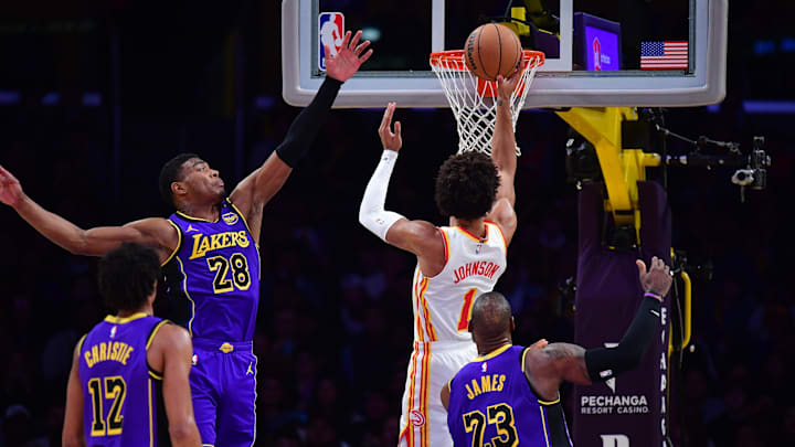 Jan 3, 2025; Los Angeles, California, USA; Los Angeles Lakers forward Rui Hachimura (28) defends against Atlanta Hawks forward Jalen Johnson (1) during the second half at Crypto.com Arena. Mandatory Credit: Gary A. Vasquez-Imagn Images
