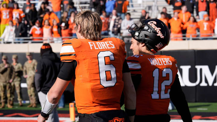 Oklahoma State's Zane Flores (6) and Noah Walters (12) walk of the field following the college football game between the Oklahoma State Cowboys and the Iowa State Cyclones at Boone Pickens Stadium in Stillwater, Okla., Saturday Nov. 29, 2025.