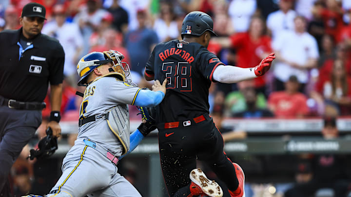 Aug 15, 2025; Cincinnati, Ohio, USA; Milwaukee Brewers catcher William Contreras (24) tags Cincinnati Reds designated hitter Miguel Andujar (38) out at home in the first inning at Great American Ball Park. Mandatory Credit: Katie Stratman-Imagn Images