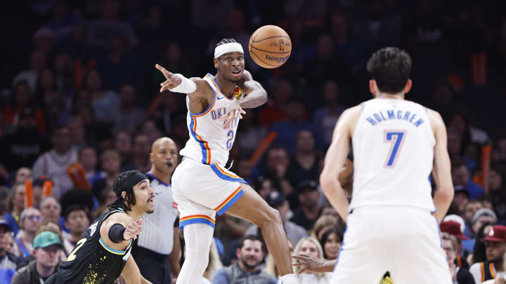 Mar 12, 2024; Oklahoma City, Oklahoma, USA; Oklahoma City Thunder guard Shai Gilgeous-Alexander (2) passes the ball to forward Chet Holmgren (7) on a play against the Indiana Pacers during the second half at Paycom Center. Mandatory Credit: Alonzo Adams-USA TODAY Sports Mar 12, 2024; Oklahoma City, Oklahoma, USA; Oklahoma City Thunder guard Shai Gilgeous-Alexander (2) passes the ball to forward Chet Holmgren (7) on a play against the Indiana Pacers during the second half at Paycom Center. Mandatory Credit: Alonzo Adams-USA TODAY Sports