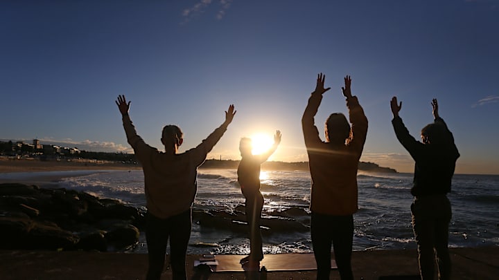 People Perform Yoga At Bondi Beach For Winter Solstice And World Yoga Day
