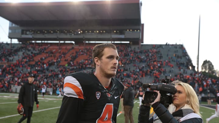 Nov 8, 2014; Corvallis, OR, USA; Oregon State Beavers quarterback Sean Mannion (4) walks off the field following a 32-39 defeat by the Washington State Cougars at Reser Stadium. Mandatory Credit: Scott Olmos-Imagn Images