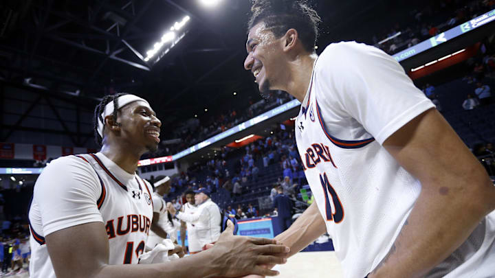 Feb 3, 2024; Oxford, Mississippi, USA; Auburn Tigers guard Denver Jones (12) reacts with Auburn