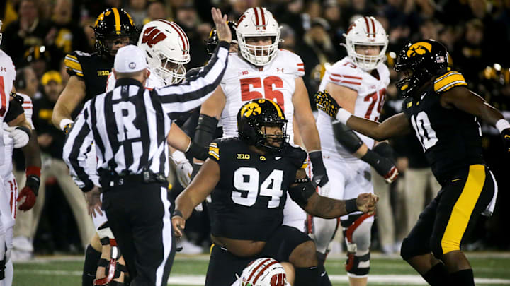 Iowa defensive lineman Yahya Black (94) tackled Wisconsin quarterback Braedyn Locke (18) in the Saturday, Nov. 2, 2024 at Kinnick Stadium in Iowa City, Iowa.