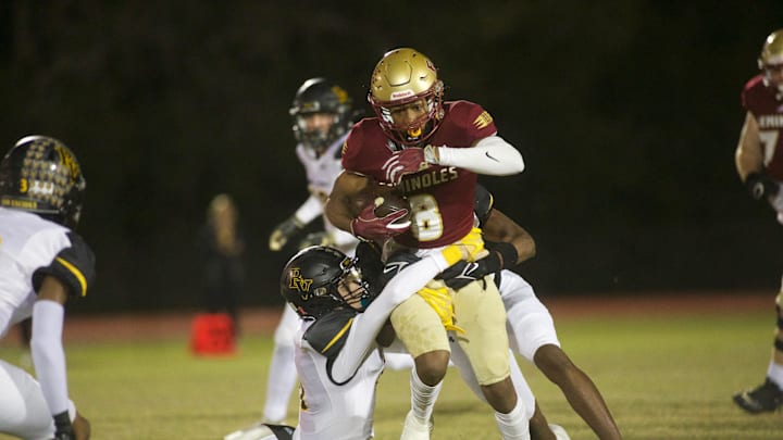 Florida High junior Micahi Danzy (8) runs through two tackles in the Class 2S state semifinal matchup between Florida High and Bishop Verot on Dec. 2, 2022, at Mike Hickman Stadium. The Seminoles won, 38-28.

J9t7666