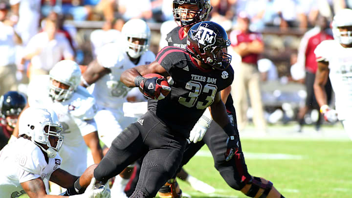 Nov 03, 2012; Starkville, MS, USA;  Texas A&M Aggies running back Christine Michael (33) advances the ball up the field during the game against the Mississippi State Bulldogs at Davis Wade Stadium.   Texas A&M Aggies defeat the Mississippi State Bulldogs 38-13.  Mandatory Credit: Spruce Derdenâ€“USA TODAY Sports
