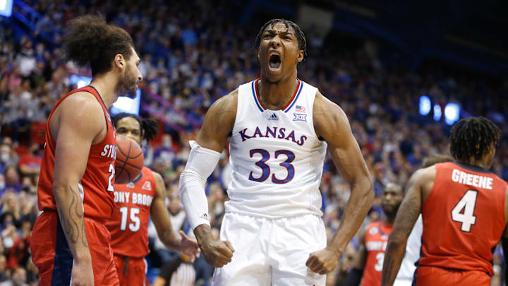 Kansas senior forward David McCormack (33) yells out after scoring over Stony Brook and grabbing a