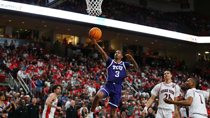 Feb 20, 2024; Lubbock, Texas, USA;  TCU Horned Frogs guard Avery Anderson III (3) goes to the basket