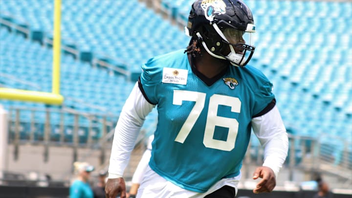 Offensive lineman Anton Harrison stretches during the 2023 Jaguars Rookie Minicamp held at TIAA Bank Field.