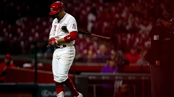 Cincinnati Reds first baseman Joey Votto (19) walks back to the dugout after striking out.
