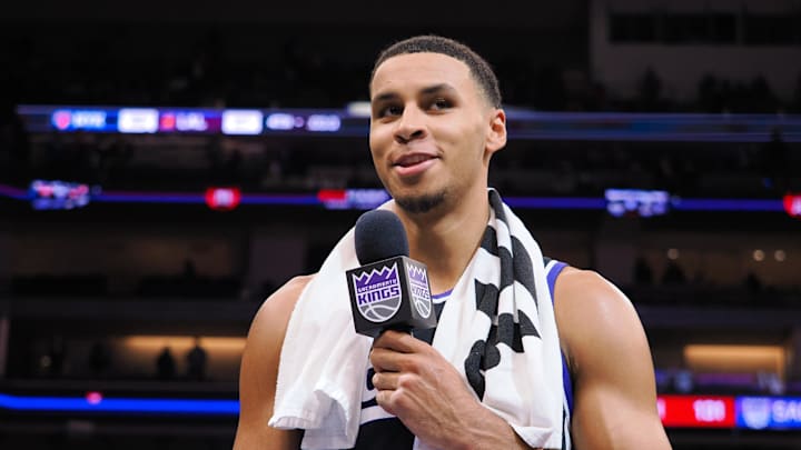 Dec 18, 2023; Sacramento, California, USA; Sacramento Kings forward Keegan Murray (13) prepares to symbolically light the beam after a win against the Washington Wizards at Golden 1 Center. Mandatory Credit: Kelley L Cox-Imagn Images