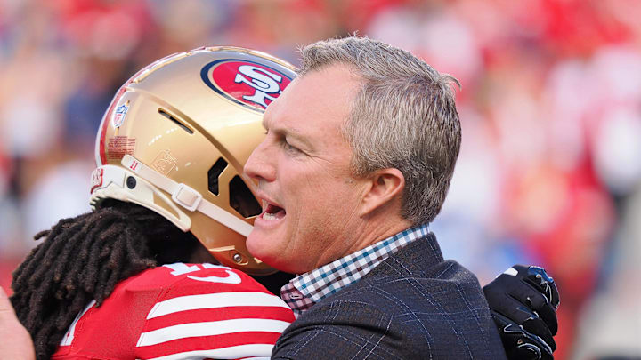 Jan 28, 2024; Santa Clara, California, USA; San Francisco 49ers general manager John Lynch hugs a player looks on before the NFC Championship football game against the Detroit Lions at Levi's Stadium. Mandatory Credit: Kelley L Cox-Imagn Images