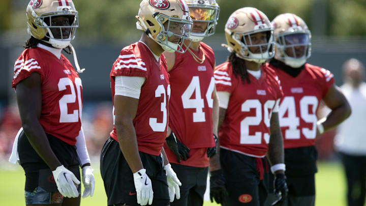 Jul 23, 2025; Santa Clara, CA, USA; San Francisco 49ers offensive backs Israel Abanikanda (20), Isaac Guerendo (31), Kyle Juszczyk (44), Jordan James (29) and Corey Kiner (49) await their reps during the first day of training camp at SAP Performance Facility. Mandatory Credit: D. Ross Cameron-Imagn Images Jul 23, 2025; Santa Clara, CA, USA; San Francisco 49ers offensive backs Israel Abanikanda (20), Isaac Guerendo (31), Kyle Juszczyk (44), Jordan James (29) and Corey Kiner (49) await their reps during the first day of training camp at SAP Performance Facility. Mandatory Credit: D. Ross Cameron-Imagn Images