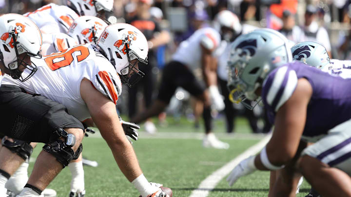 Sep 28, 2024; Manhattan, Kansas, USA; Oklahoma State Cowboys offensive lineman Joe Michalski (66) waits to snap the ball against the Kansas State Wildcats during the third quarter at Bill Snyder Family Football Stadium. Mandatory Credit: Scott Sewell-Imagn Images
