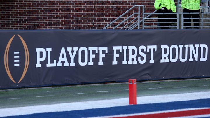 Dec 20, 2025; Oxford, MS, USA; College Football First Round logo on field prior to the game between the Tulane Green Wave and  the Mississippi Rebels at Vaught-Hemingway Stadium. Mandatory Credit: Petre Thomas-Imagn Images