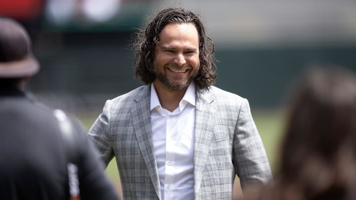 Apr 26, 2025; San Francisco, California, USA; Former San Francisco Giants shortstop Brandon Crawford smiles following a ceremony to honor his legacy with the team before a game against the Texas Rangers at Oracle Park. 