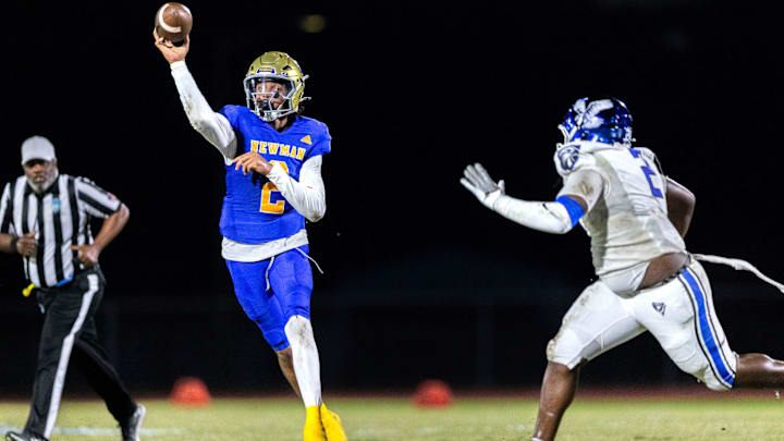 Cardinal Newman quarterback Jyron Hughley passes the ball against Community School of Naples 45-14 during their playoff game on November 21, 2025, in West Palm Beach, Florida.