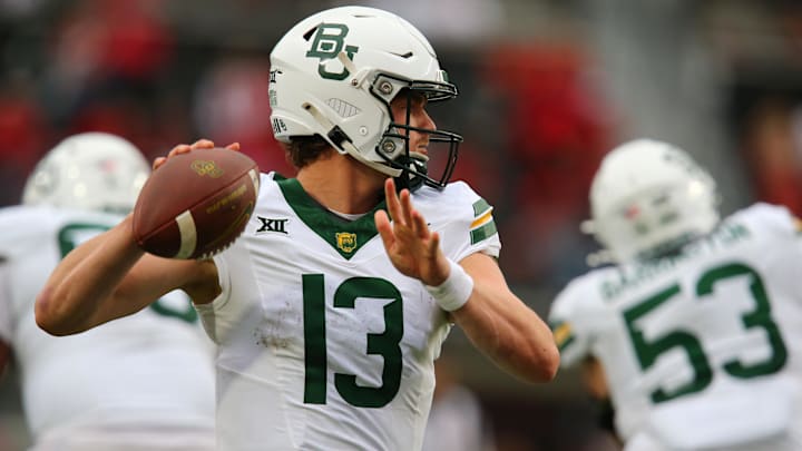 Oct 19, 2024; Lubbock, Texas, USA;  Baylor Bears quarterback Sawyer Robertson (13) throws against the Texas Tech Red Raiders in the second half at Jones AT&T Stadium and Cody Campbell Field. Mandatory Credit: Michael C. Johnson-Imagn Images