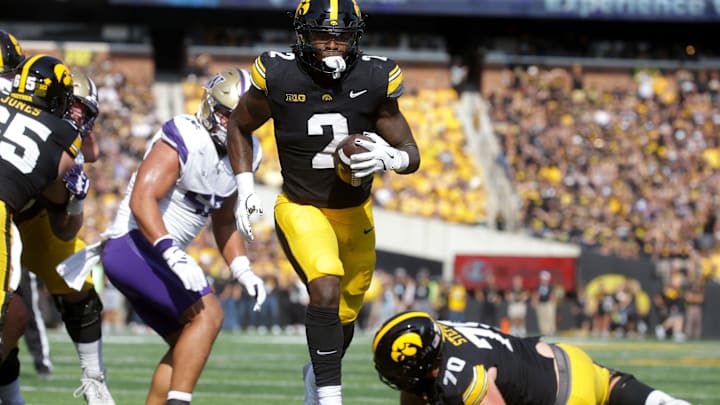 Iowa’s Kaleb Johnson (2) runs to the endzone to score against Washington Saturday, Oct. 12, 2024 at Kinnick Stadium in Iowa City, Iowa.