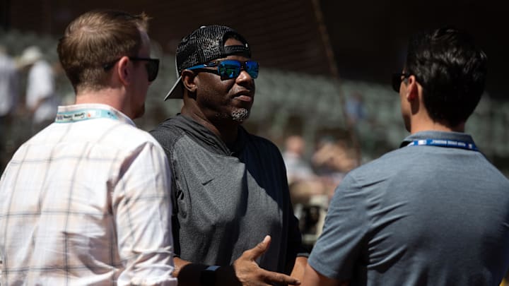 Former Seattle Mariners star Ken Griffey Jr. (center) chats with other team officials before a game against the Oakland Athletics at Oakland-Alameda County Coliseum in 2024.