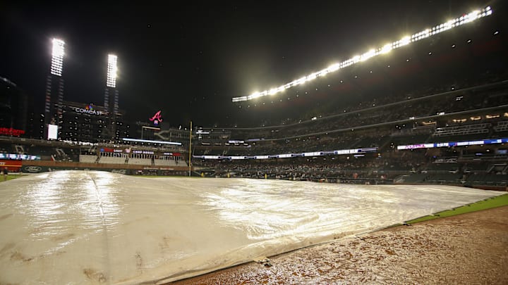 Aug 15, 2022; Atlanta, Georgia, USA; A tarp on the field at Truist Park during a rain delay in the second inning of a game between the Atlanta Braves and New York Mets. Mandatory Credit: Brett Davis-Imagn Images
Aug 15, 2022; Atlanta, Georgia, USA; A tarp on the field at Truist Park during a rain delay in the second inning of a game between the Atlanta Braves and New York Mets. Mandatory Credit: Brett Davis-Imagn Images