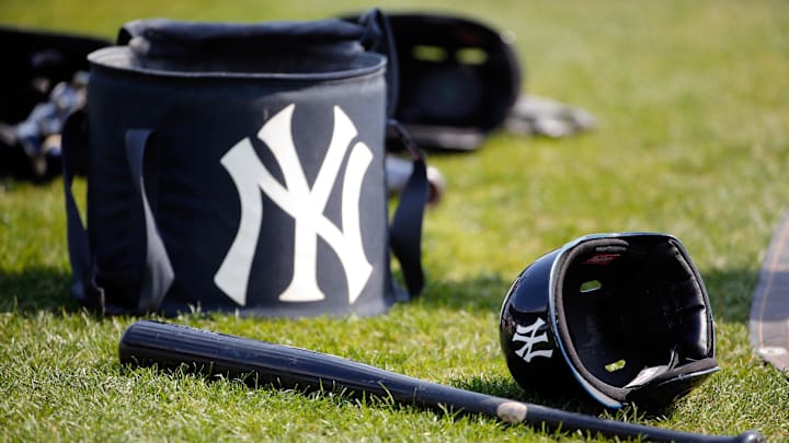 Mar 23, 2017; Port Charlotte, FL, USA; New York Yankees helmet, bat and bags lay on the field prior to their spring training game against the Tampa Bay Rays at Charlotte Sports Park. Mandatory Credit: Kim Klement-Imagn Images