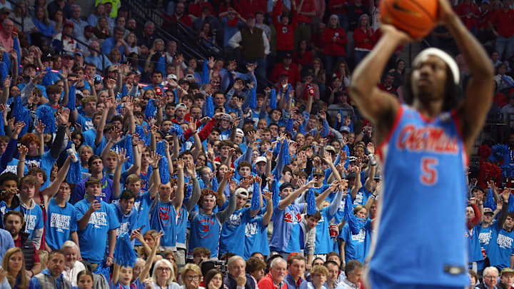 Feb 1, 2025; Oxford, Mississippi, USA; Mississippi Rebels fans hold up their hands as Mississippi Rebels guard Jaylen Murray (5) shoots a free throw during the second half against the Auburn Tigers at The Sandy and John Black Pavilion at Ole Miss. Mandatory Credit: Petre Thomas-Imagn Images