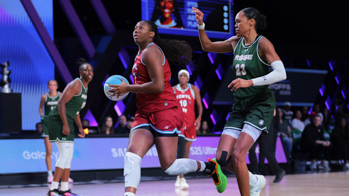 Mar 17, 2025; Miami, FL, USA; Vinyl BC forward Aliyah Boston (7) drives to the basket past Rose BC forward Azura Stevens (23) during the first quarter of the Unrivaled Championship game at Wayfair Arena. Mandatory Credit: Sam Navarro-Imagn Images