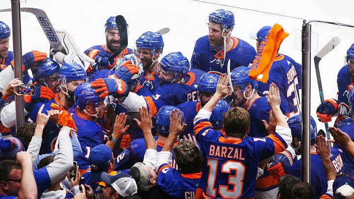 Jun 23, 2021; Uniondale, New York, USA; New York Islanders left wing Anthony Beauvillier (18) is congratulated by his teammates after scoring the game winning goal against the Tampa Bay Lightning in overtime in game six of the 2021 Stanley Cup Semifinals at Nassau Veterans Memorial Coliseum. Mandatory Credit: Andy Marlin-USA TODAY Sports