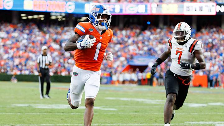 Sep 12, 2026; Gainesville, Florida, USA;  Florida Gators wide receiver Vernell Brown III (1) runs with the ball for a touchdown against the Campbell Fighting Camels during the first half at Ben Hill Griffin Stadium.  Mandatory Credit: Matt Pendleton-Imagn Images