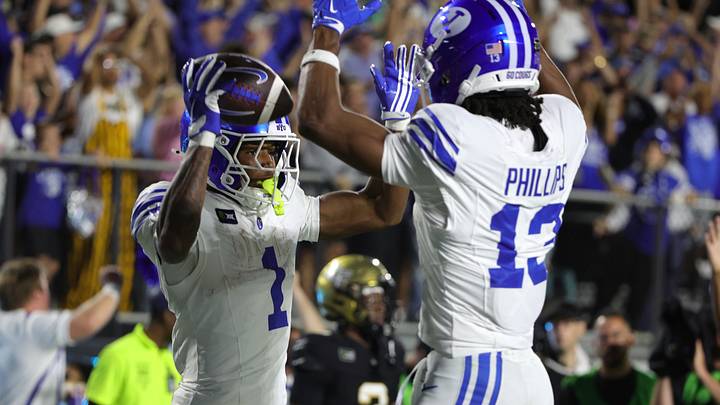 Oct 24, 2026; Orlando, Florida, USA; Brigham Young Cougars wide receiver Legend Glasker (1) celebrates his touchdown in the first overtime with Jojo Phillips (13) against the Central Florida Knights at Acrisure Bounce House. Mandatory Credit: Mike Watters-Imagn Images Oct 24, 2026; Orlando, Florida, USA; Brigham Young Cougars wide receiver Legend Glasker (1) celebrates his touchdown in the first overtime with Jojo Phillips (13) against the Central Florida Knights at Acrisure Bounce House. Mandatory Credit: Mike Watters-Imagn Images