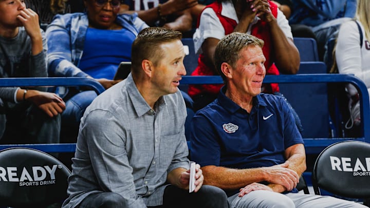 ESPN analyst Sean Farnham and Gonzaga head coach Mark Few watch the action during 2024 Kraziness in the Kennel.