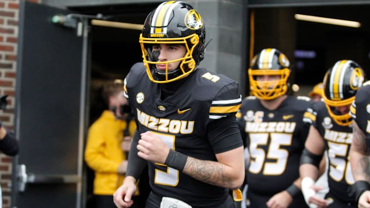 Nov 8, 2025; Columbia, Missouri, USA; Missouri Tigers quarterback Matt Zollers runs out of the tunnel ahead of the Missouri matchup against Texas A&M at Faurot Field.