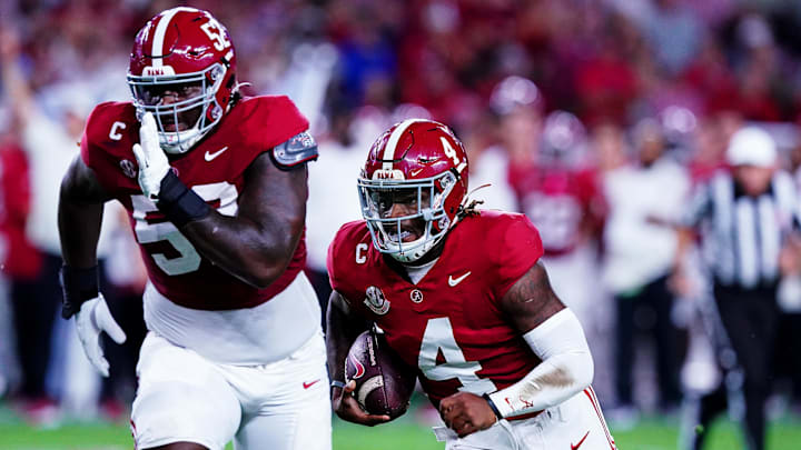 Sep 28, 2024; Tuscaloosa, Alabama, USA; Alabama Crimson Tide quarterback Jalen Milroe (4) runs for a touchdown during the first quarter against the Georgia Bulldogs at Bryant-Denny Stadium. Mandatory Credit: John David Mercer-Imagn Images