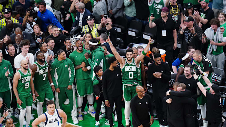 Jun 17, 2024; Boston, Massachusetts, USA; Boston Celtics forward Jayson Tatum (0) celebrates with teammates after defeating the Dallas Mavericks in game five to win the 2024 NBA Finals at TD Garden. Mandatory Credit: David Butler II-USA TODAY Sports