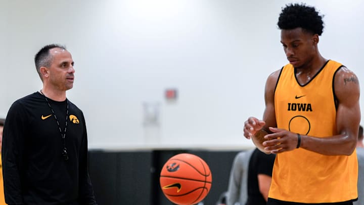 Iowa men’s basketball head coach Ben McCollum talks to Tavion Banks (6) as he prepares to shoot a free throw during practice June 19, 2025 at Carver-Hawkeye Arena in Iowa City, Iowa.