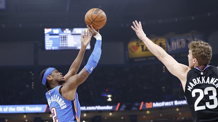 Jan 22, 2025; Oklahoma City, Oklahoma, USA; Oklahoma City Thunder guard Shai Gilgeous-Alexander (2) shoots as Utah Jazz forward Lauri Markkanen (23) defends during the first quarter at Paycom Center. Mandatory Credit: Alonzo Adams-Imagn Images Jan 22, 2025; Oklahoma City, Oklahoma, USA; Oklahoma City Thunder guard Shai Gilgeous-Alexander (2) shoots as Utah Jazz forward Lauri Markkanen (23) defends during the first quarter at Paycom Center. Mandatory Credit: Alonzo Adams-Imagn Images